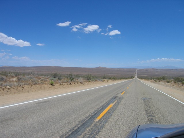 One of the many roads to forever in the desert.  This was on the Trona Road.