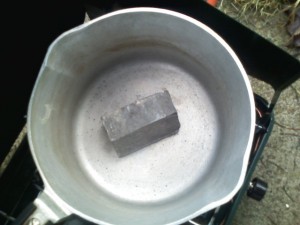 Small lead ingot being melted as a first test run.