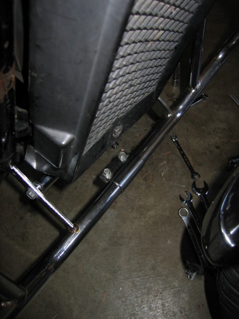 Cross-bar in front of radiator.  The radiator shroud must be removed during installation.